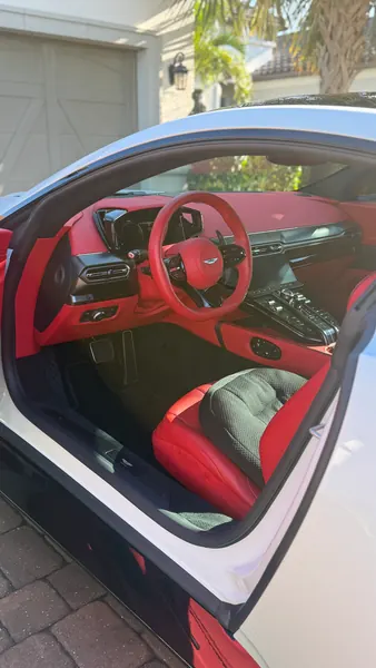 Clean red leather interior of an Aston Martin Vantage