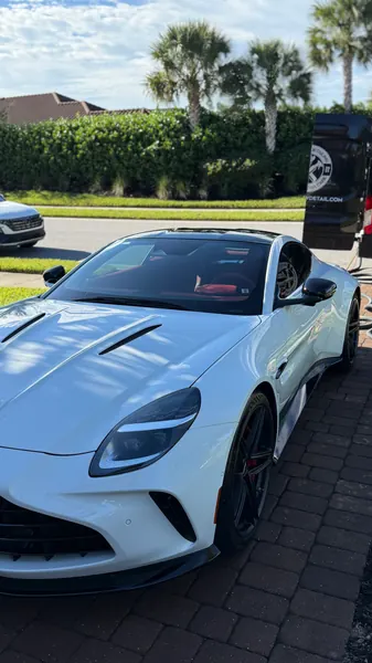 White Aston Martin Vantage front view with glossy paint