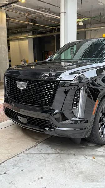 Black Cadillac Escalade front view with glossy paint
