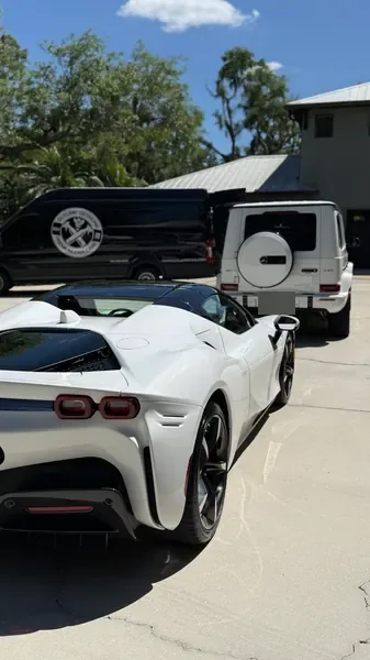 White Ferrari with the Outlaw Detailing mobile van in the background