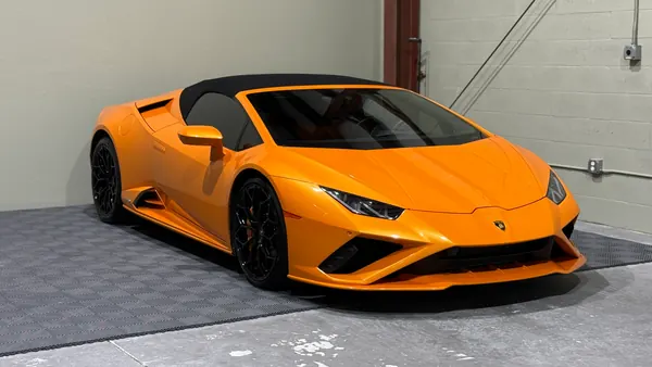 Orange Lamborghini Huracán convertible with a glossy finish, ceramic coating client in Sarasota