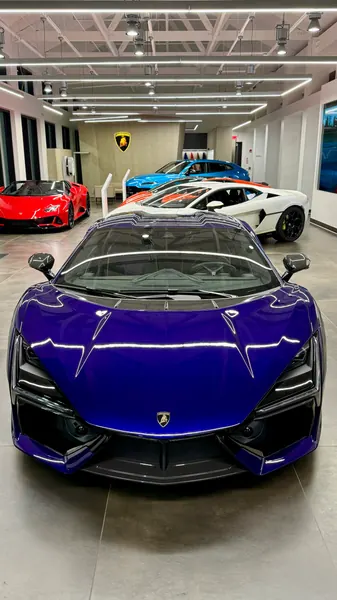 Front view of a purple Lamborghini Revuelto in the Lamborghini Sarasota showroom after a detail and polish