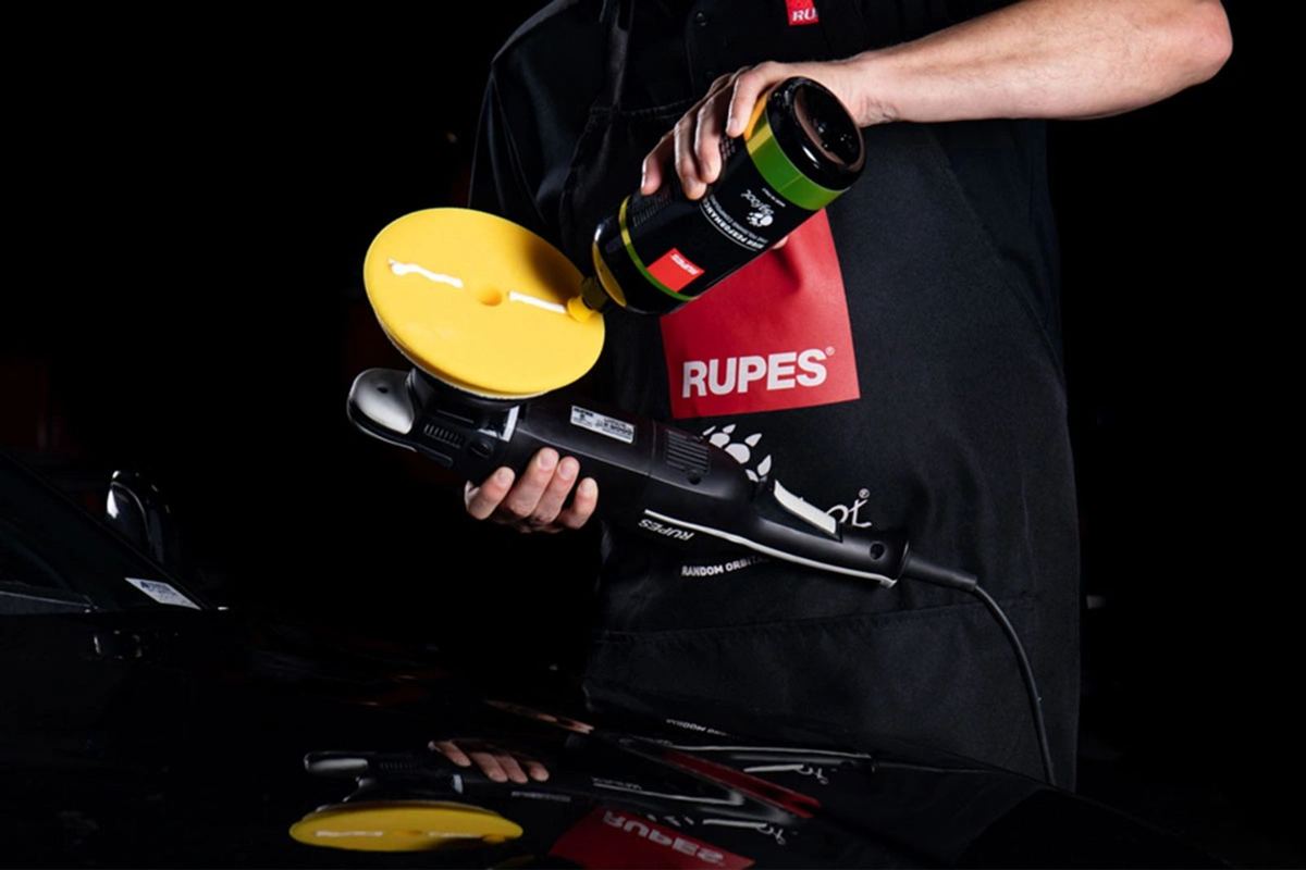 Fine polishing compound being applied with a machine polisher